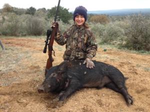 Kaitlyn takes a nice hog with her granddad. Way to go, Kaitlyn!